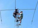 Greg N8TJD and Alan W8OP make last-minute adjustments to the FD beam. [WB8SCG Photo]