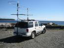In CO70 just north of the 50 Degree grid line for CO70/CN79 in Campbell River on the east coast of Vancouver Island.   Good overwater shot to Seattle several hundred miles away.  

Antenna farm top to bottom: 6M loop, 2M 10el, 1296 28el looper, 222 9el and 432 14el 8ft end mounted homebrew K1FO designs.  Had to leave the 903 home, TX power amp stage not working.   Solid 1.25" fiberglass rod front mast and crossboom bolted to an aluminum rectanglular stock mounted to the roof rack plus a hitch mounted rear pole withstood the miles of overgrown brush and logging road potholes.