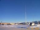 The KL7AA mobile communications center with the 80m vertical in the foreground.