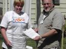 Steve, K2CX receives a certificate of participation from Cathy Pearsall, KC2ACJ SCRC president