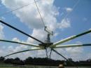 The antenna is almost down for an element change.  The pulleys above the rotator made it easy to center the antenna between the masts so that it wouldn't hit the mast guys when rotating.