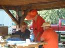 Club President, KA4HWX looks over the log sheet while Paul, N9QYK (on left) helps a visitor operate the GOTA station.