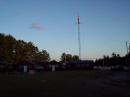 Field Day site at sunrise with 40' tower supporting 40 meter loop, G5RV, and 2 meter beam