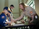 Workers from BSA International Department give special badge and information to all scouts who attended.