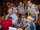A diverse group of Scouts and leaders work a contact on one of the IRLP stations.