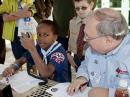A Cub Scout tries his hand at an HF contact.