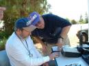 WN6QJN and WA6BZ trying to figure out what the problem was with the rig, figured that one battery was going dead. 
