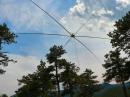 The Moxon Beam is hoisted up on ropes and pulleys using the available trees for supports. A rotor is added that gives the beam full flexibilty.