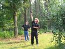 Putting up dipoles way up in trees is an art demonstrated by Larry (WT4XX) with launcher and Darrel (KG4MVD) keeping an eye where it goes.