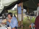 Stu 2, W7IY on left, finalizing the 432 station equiment.  Lee, KD4JXZ, is holding up the center tent pole.