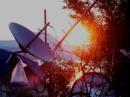Sunrise backlighting the satellite link erected, 
serviced and operated by Bill--K5AXW, the only
one that understood it.