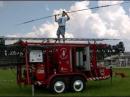 Kevin Thomas prepares to set up a 100-foot antenna for communication reception