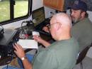 Tom-W0UY at the control point. Bill-KC0VBF and Reno County Emergency Management Director logging QSO's.