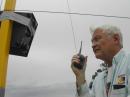 The 80M vertical was not exactly pretty.  Here is Tod-K0TO making some last minute adjustments to the tuner that was duct taped to the elevated vertical.