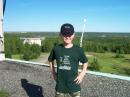 Future ham...hi hi
In background is silo holding CW beam, with extended boom for dipoles to right of Brady. Young Brady completed his first QSO this field day!