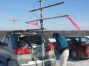 Paul, W2TAU, digging for hardware or tools to raise the antennas.