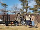 KI4PKW, KG4YVA, and KU4JZ prepare the mast and tower supporting the 50 and 144 mhz. yagi antennas.