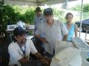 Jorge-NP3HM giving a demo on 20 meters to Jose-KP4JFR and Vilmarie-NP3YL meanwhile on the back Pedro-NP4A observes.