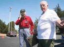 Michael KA6PGN, retired sergeant first class, hands over the phone of his World War II-era ham radio to retired
U.S. Army Col. Tom W6GGR. (Daniel Solomon/The Eureka Reporter)