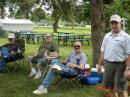 L-R John KG0UA, Jim K0NK, and George WB0CNK, take a lunch break before operating.